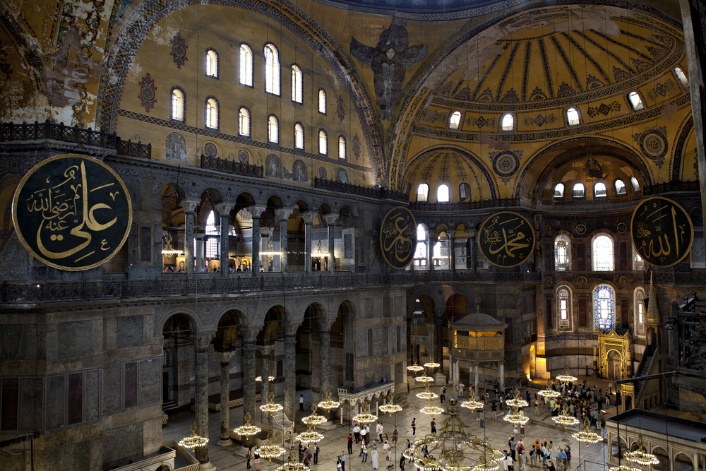 Hagia Sophia interior with columns, arches, and layered Byzantine and Ottoman architectural details in Istanbul